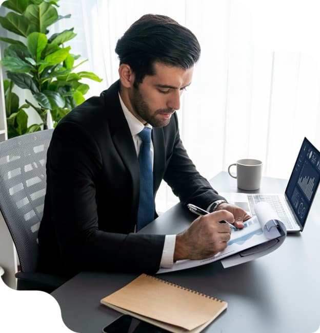 Business professional reviewing reports